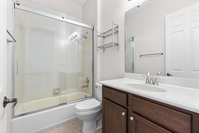 full bathroom with tile patterned floors, vanity, toilet, and enclosed tub / shower combo