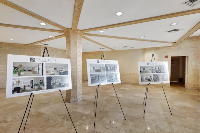 interior space featuring beamed ceiling and tile walls