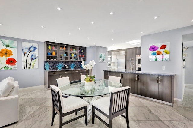 dining room featuring sink