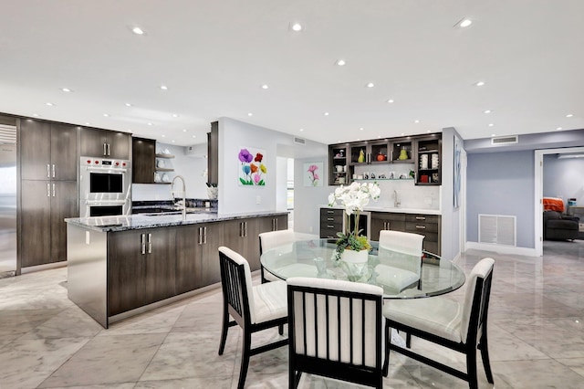 dining room featuring sink