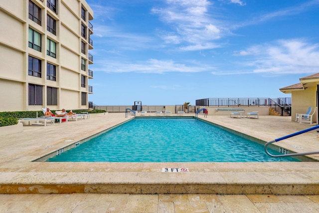 view of swimming pool featuring a patio