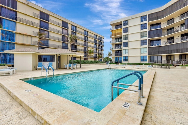 view of swimming pool featuring a patio area