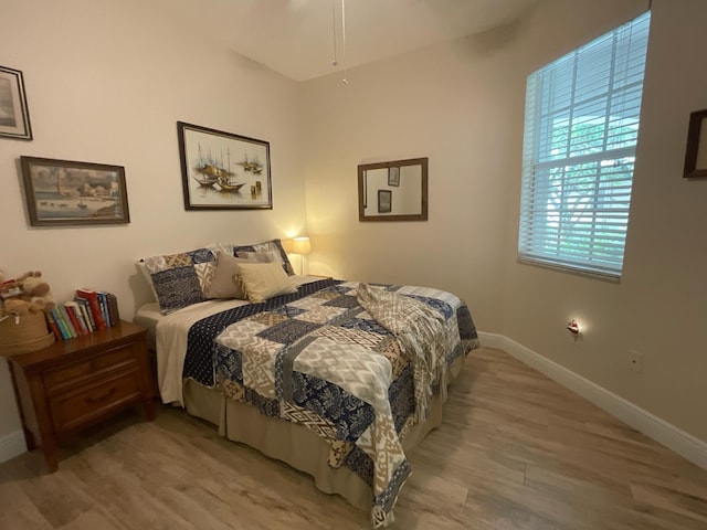 bedroom with light hardwood / wood-style flooring