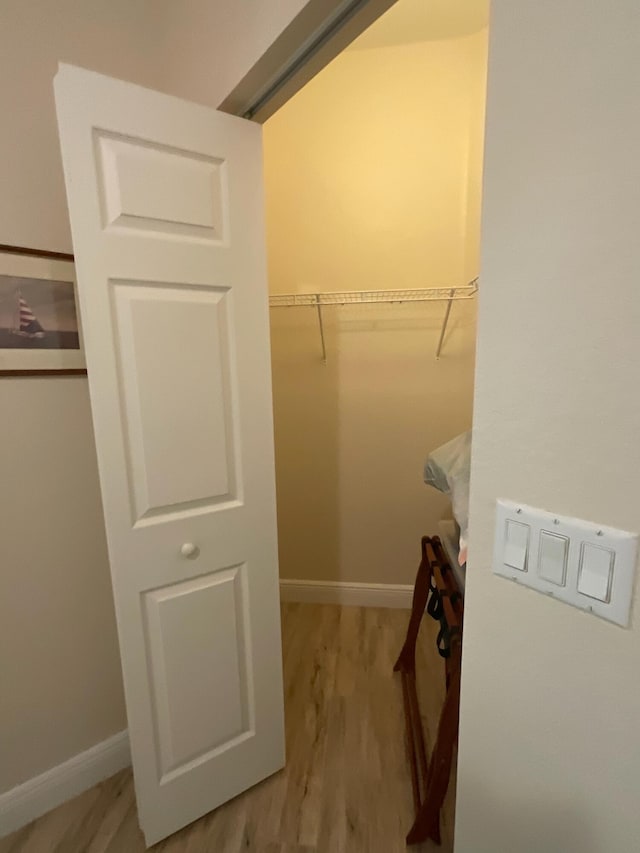 walk in closet featuring light hardwood / wood-style floors