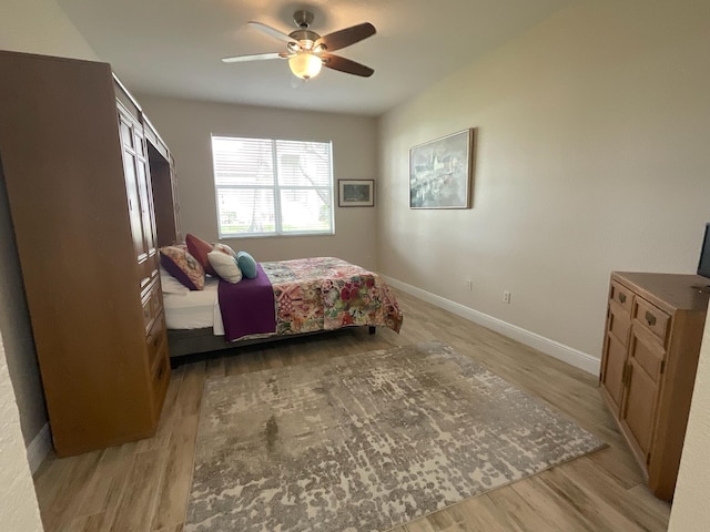 bedroom featuring ceiling fan and light wood-type flooring