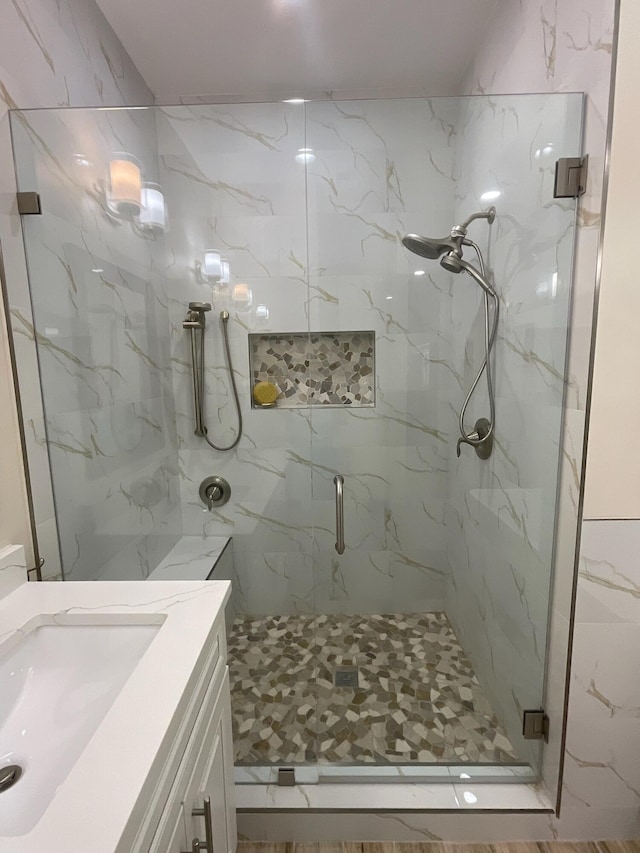 bathroom with vanity and walk in shower