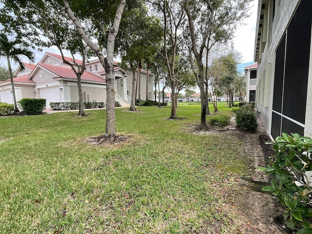 view of yard with a garage