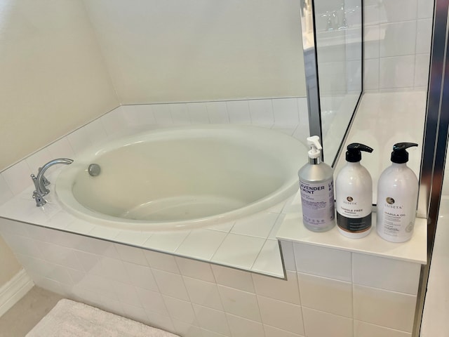 bathroom with tiled tub