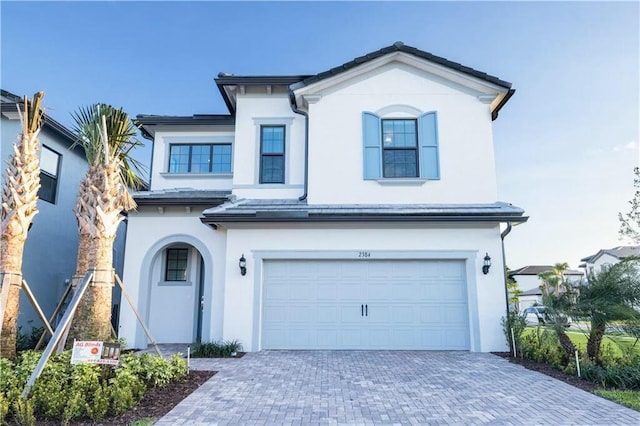 view of front of property with a garage