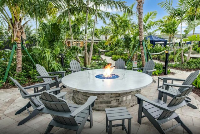 view of patio / terrace featuring a fire pit