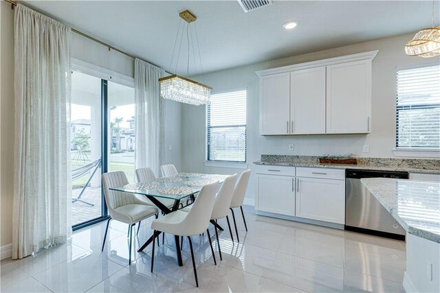 dining room featuring plenty of natural light