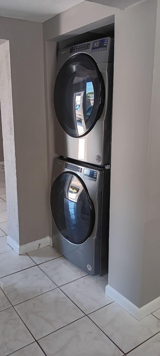 laundry room with stacked washer and clothes dryer