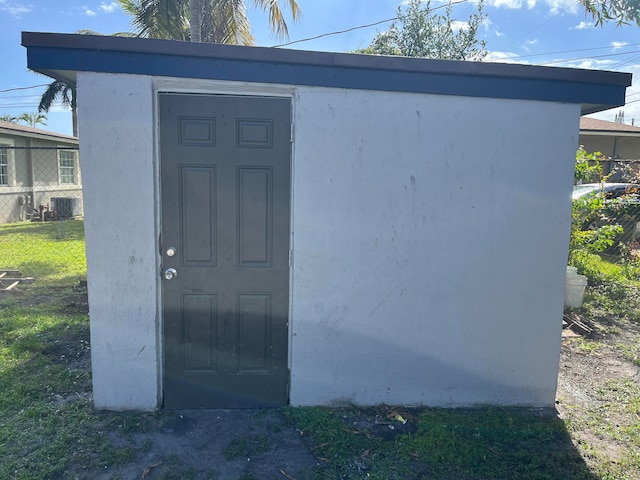 view of outbuilding featuring central air condition unit