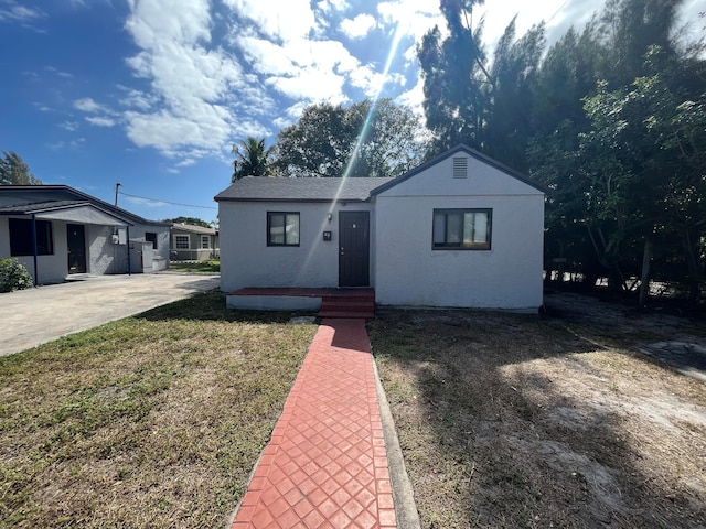 bungalow with a front yard