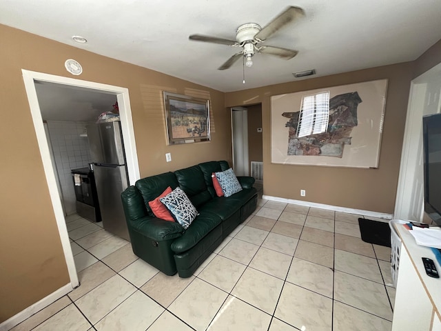 tiled living room with ceiling fan