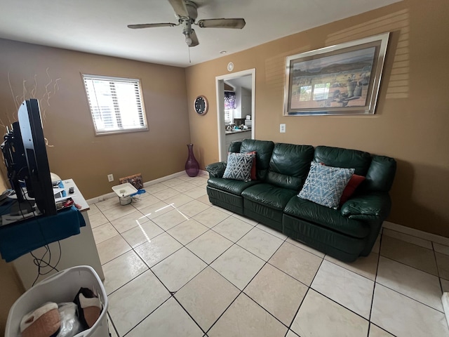 tiled living room with ceiling fan