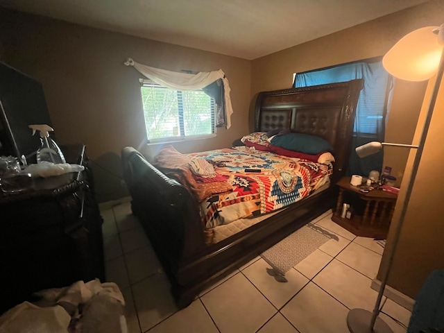 bedroom featuring light tile patterned flooring