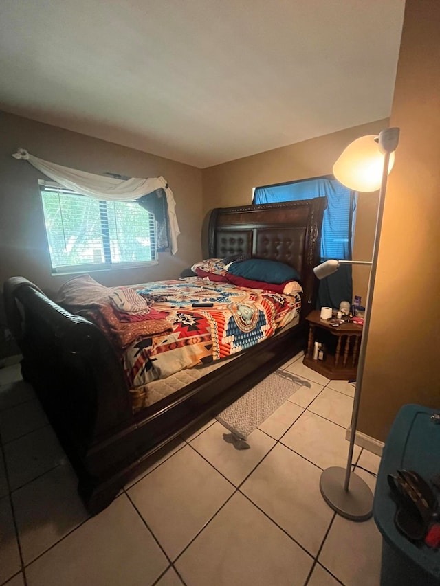 bedroom with light tile patterned flooring