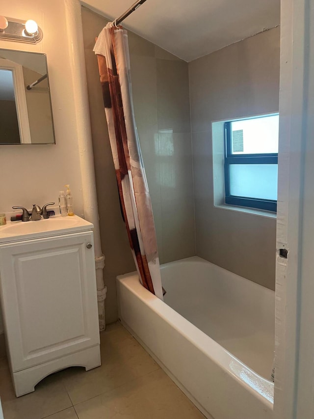 bathroom featuring vanity, tile patterned floors, and shower / tub combo with curtain