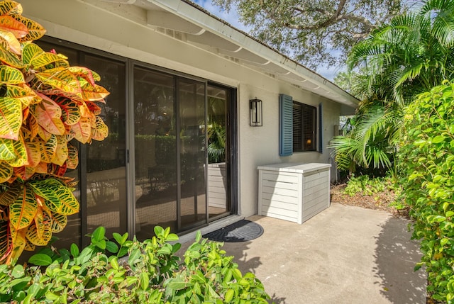 doorway to property with a patio