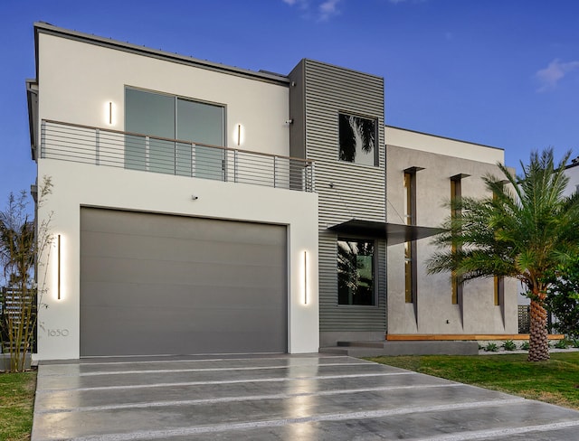 contemporary house with a balcony and a garage