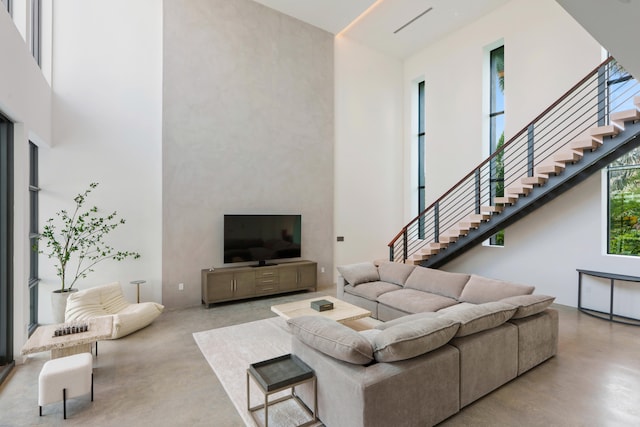 living room with a high ceiling