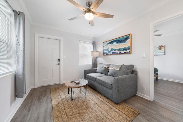 living room with ornamental molding, hardwood / wood-style floors, and ceiling fan