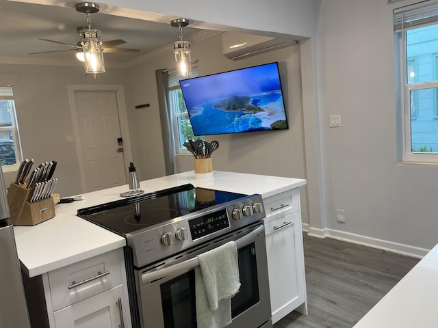 kitchen with dark hardwood / wood-style floors, pendant lighting, white cabinetry, stainless steel range with electric cooktop, and ornamental molding