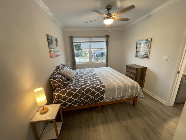 bedroom featuring crown molding, hardwood / wood-style floors, and ceiling fan