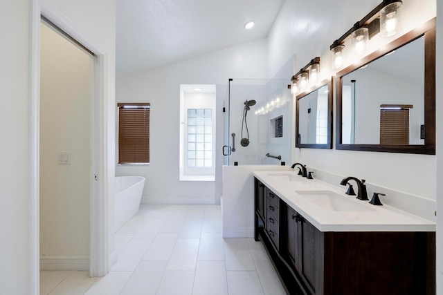 bathroom featuring separate shower and tub, tile patterned floors, and vaulted ceiling