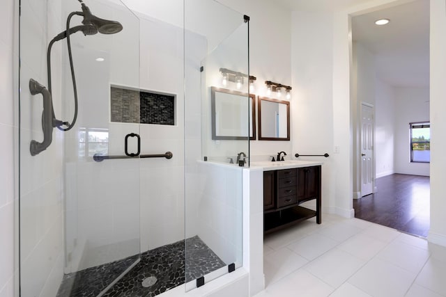 2843 SW Mariposa Cir, Palm City, FL 34990 - bathroom with a stall shower, double vanity, recessed lighting, tile patterned floors, and baseboards