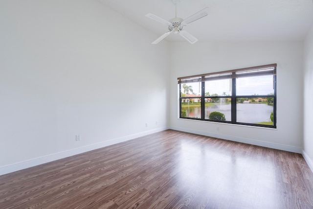 unfurnished room with ceiling fan, wood-type flooring, and high vaulted ceiling