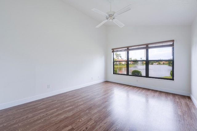 2843 SW Mariposa Cir, Palm City, FL 34990 - unfurnished room with wood finished floors, high vaulted ceiling, baseboards, and ceiling fan