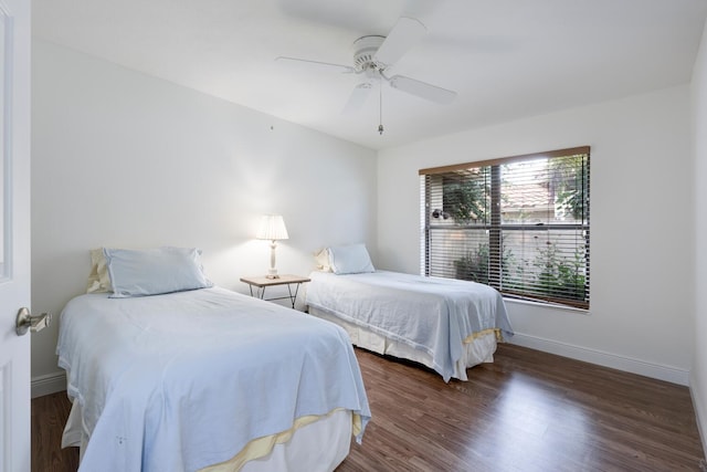 bedroom featuring ceiling fan and dark hardwood / wood-style floors