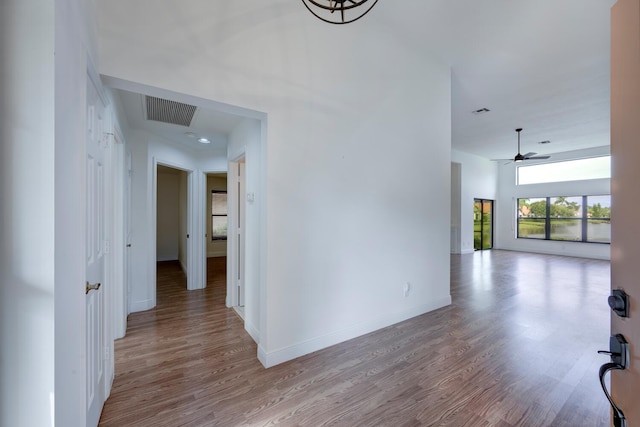 hall with light hardwood / wood-style floors