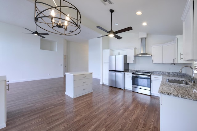 2843 SW Mariposa Cir, Palm City, FL 34990 - kitchen with appliances with stainless steel finishes, wall chimney exhaust hood, ceiling fan, a sink, and dark wood-style floors