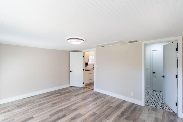 unfurnished room with light hardwood / wood-style flooring