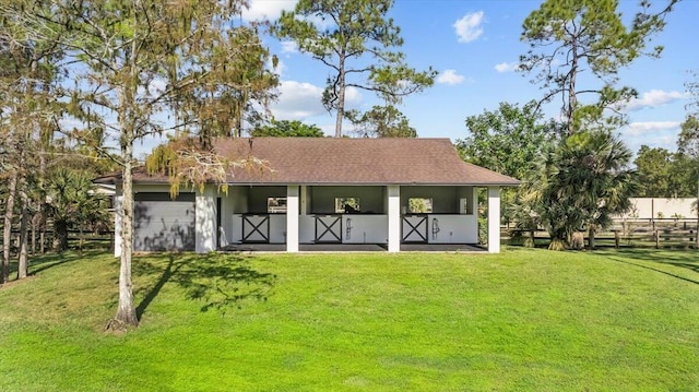 back of house featuring a yard