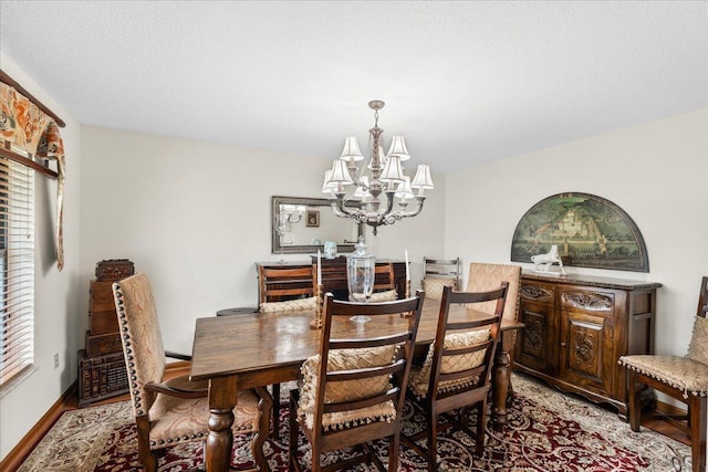 dining room featuring a chandelier