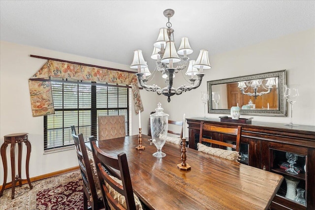 dining space featuring a notable chandelier