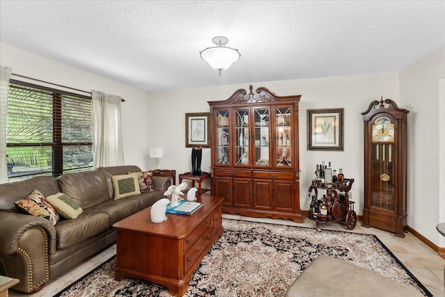 tiled living room with a textured ceiling