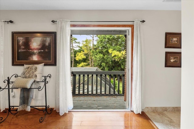 doorway to outside featuring hardwood / wood-style flooring