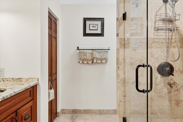 bathroom featuring vanity and an enclosed shower