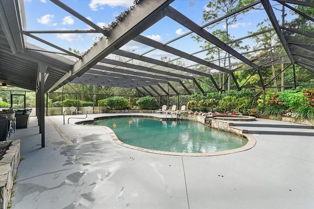 view of pool featuring a patio area, an in ground hot tub, and glass enclosure