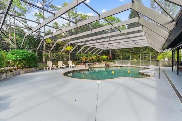 view of swimming pool with a lanai and a patio area