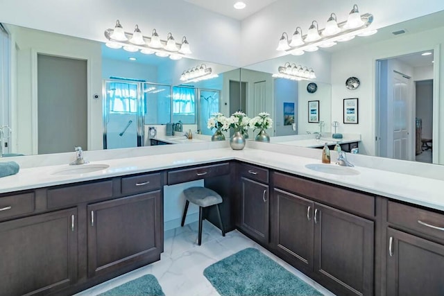 bathroom featuring vanity and an enclosed shower