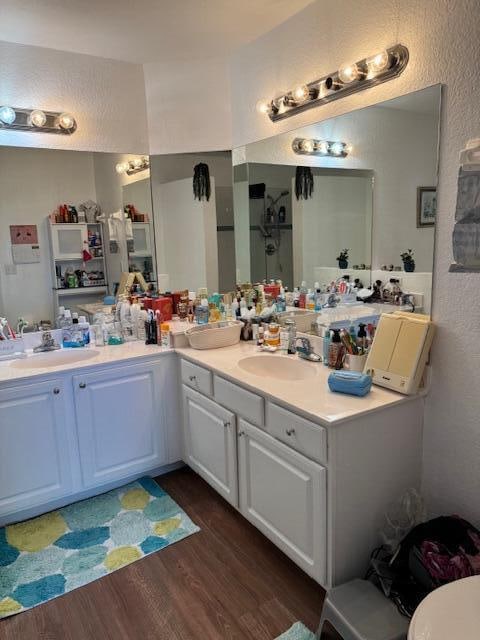 bathroom featuring hardwood / wood-style flooring and vanity