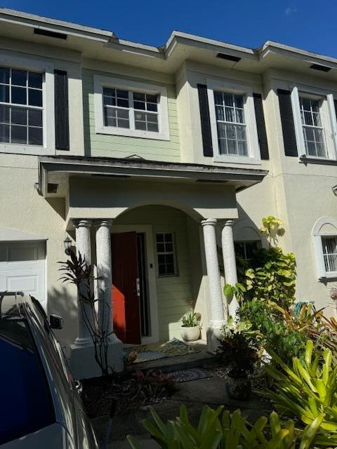 view of front of property with a garage