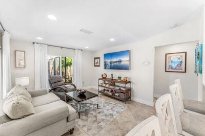 living room with light carpet and lofted ceiling