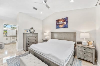 bedroom with ceiling fan and lofted ceiling